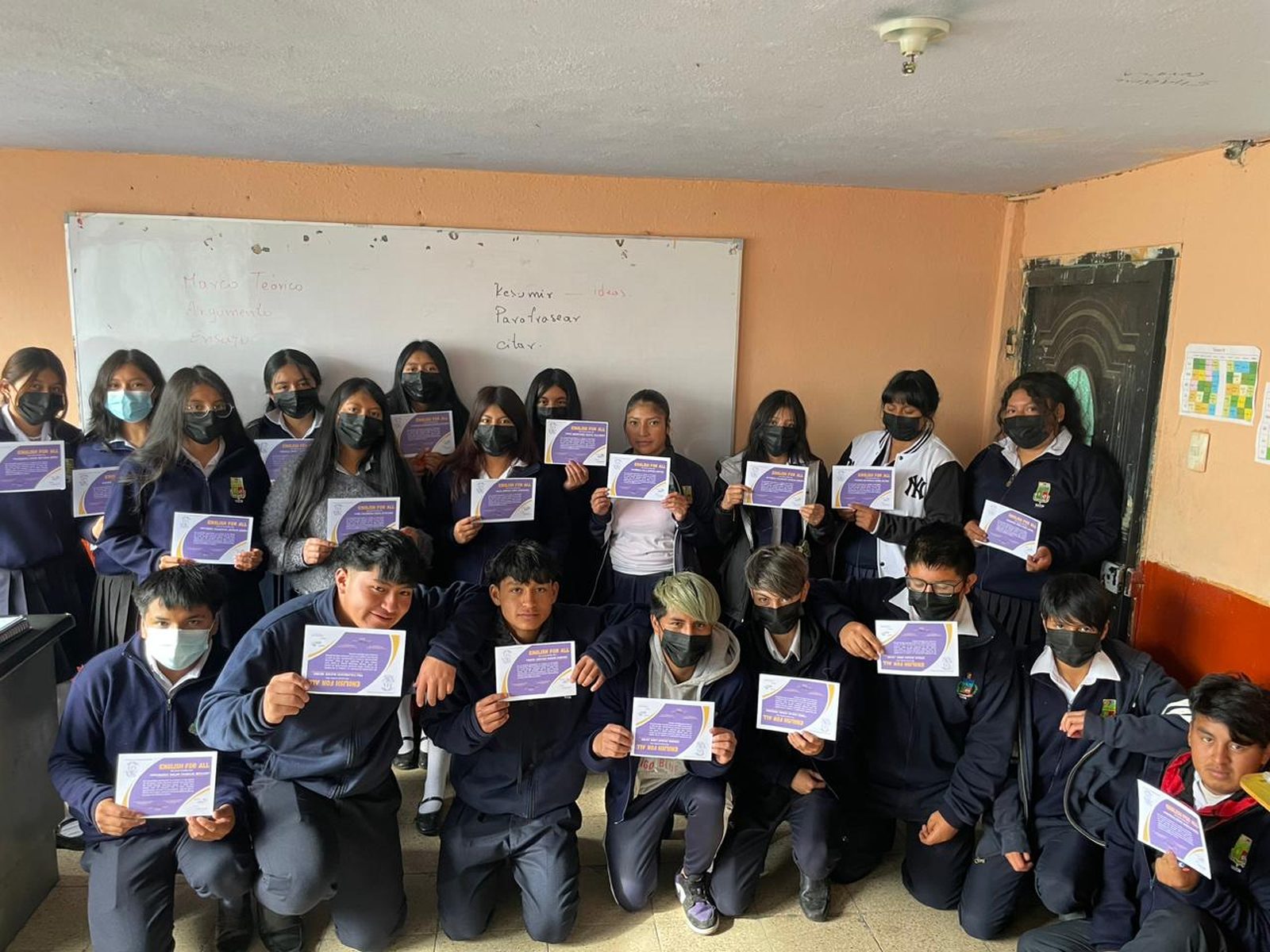 Students holding English for All certificates after completing a program